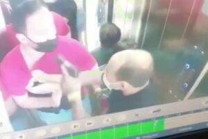 Homem que ameaçou outra pessoa com pistola dentro do elevador é PM de Minas Gerais (Foto: Reprodução - TVAnhanguera)